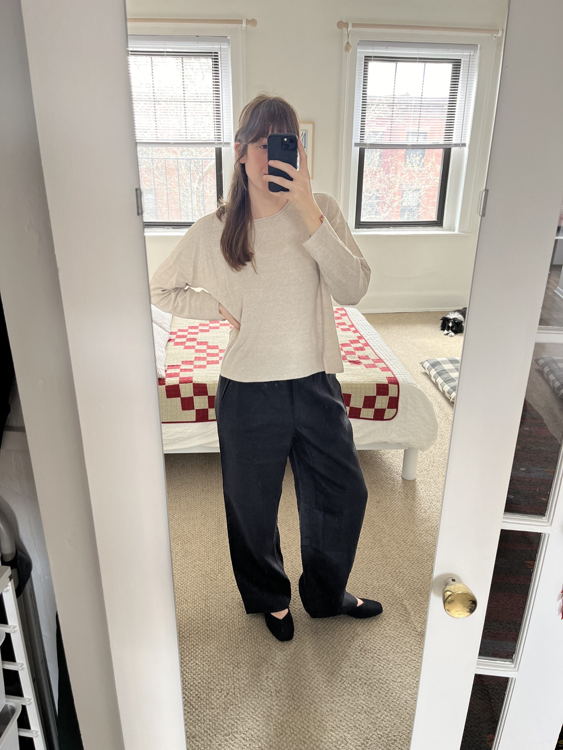 TGT editor wears black linen pants and a beige longsleeve from EILEEN FISHER.