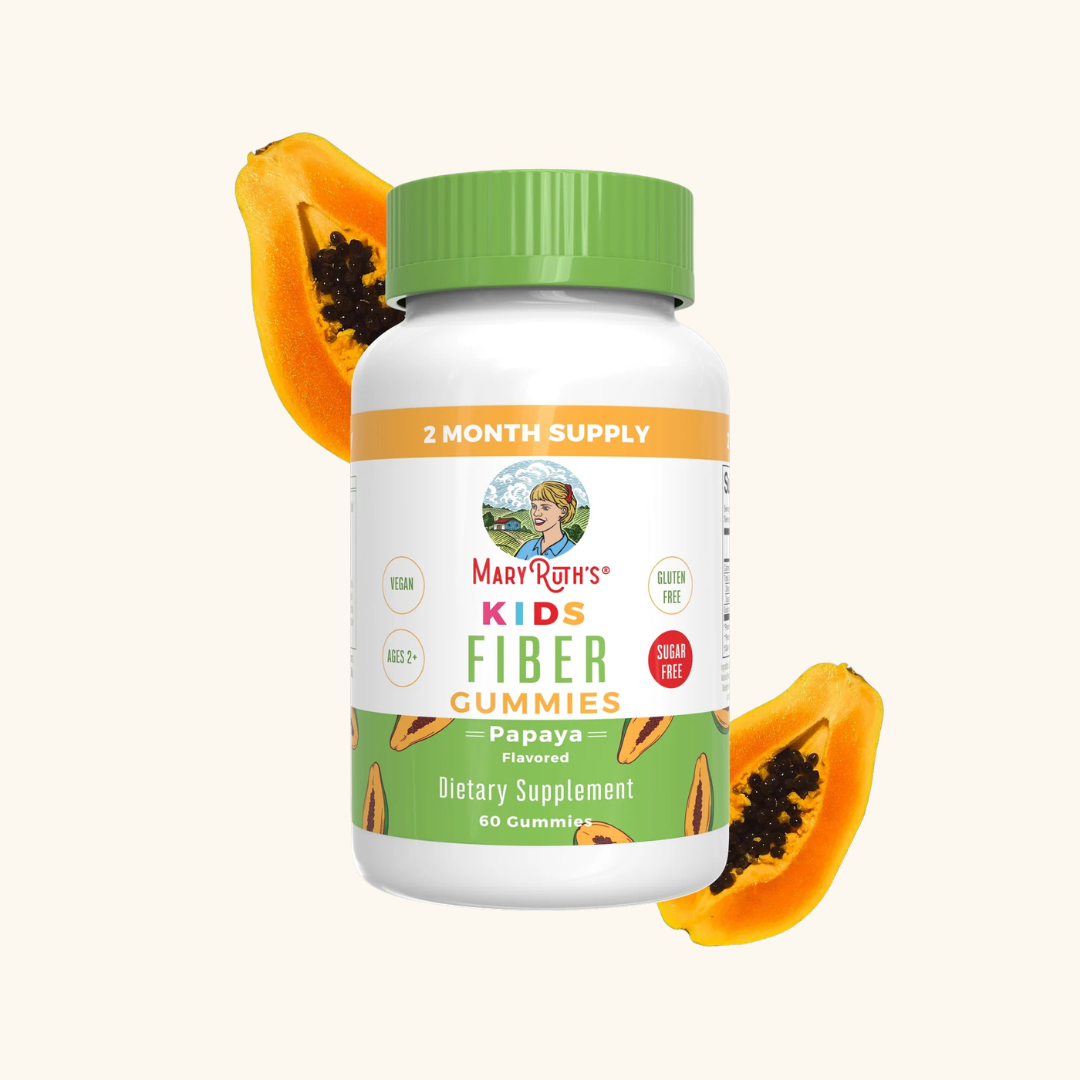 A bottle of MaryRuth’s Kids Fiber Gummies, papaya flavored, with two papaya halves in the background. The label highlights vegan, gluten free, sugar free, and age 2+ features.